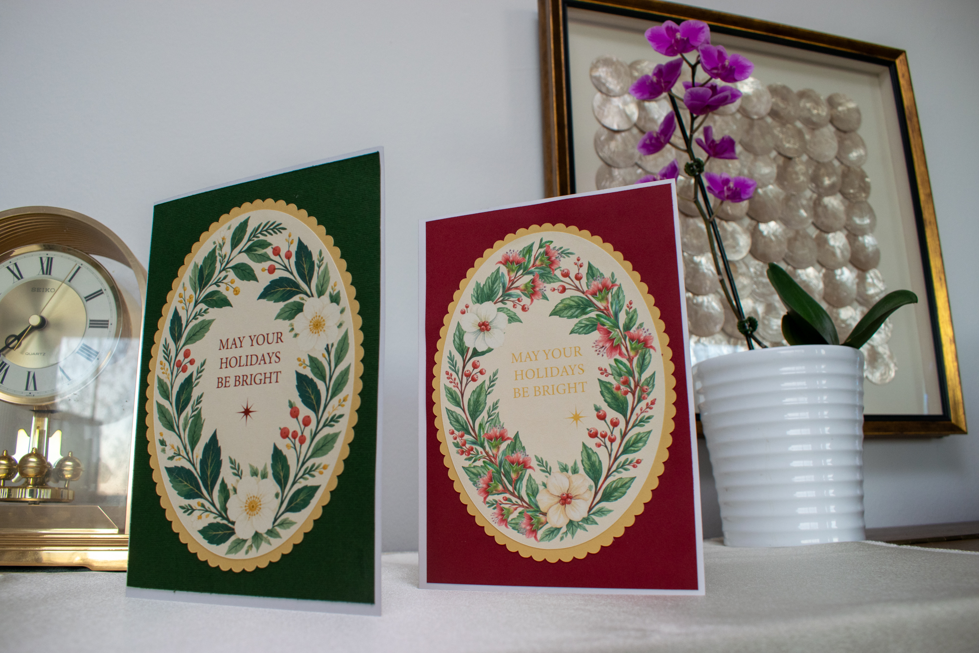 Two professionally printed holiday cards with floral artwork