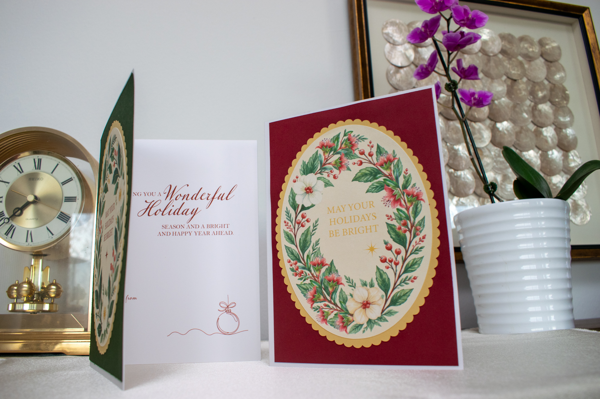 Holiday card collection showing floral and seasonal card designs