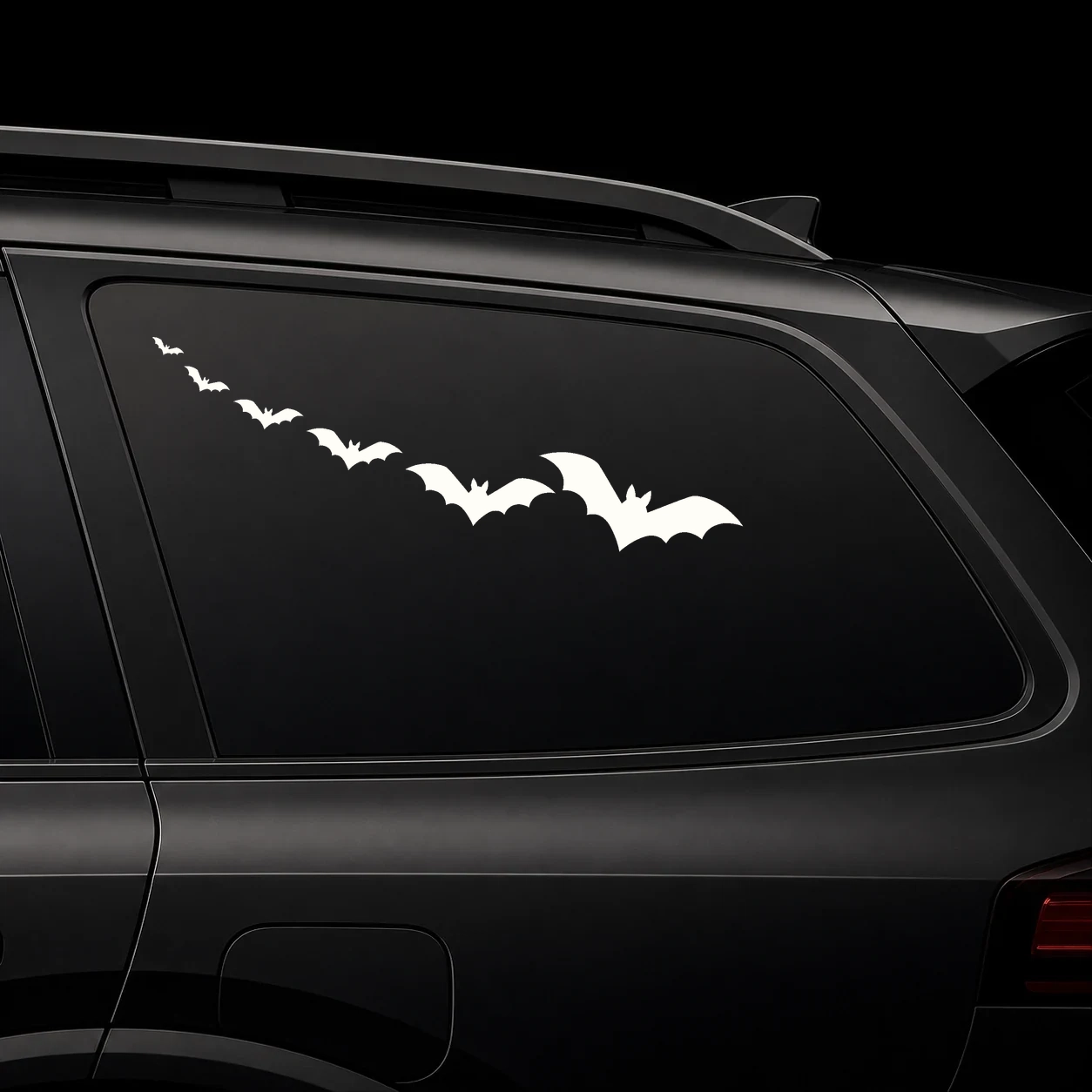 A trail of bats sweeping away from a dark vehicle side mirror