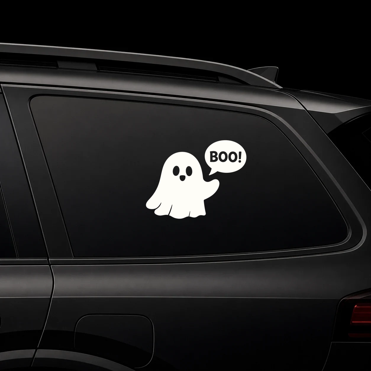 Cute waving ghost with Boo speech bubble decal on a dark vehicle window