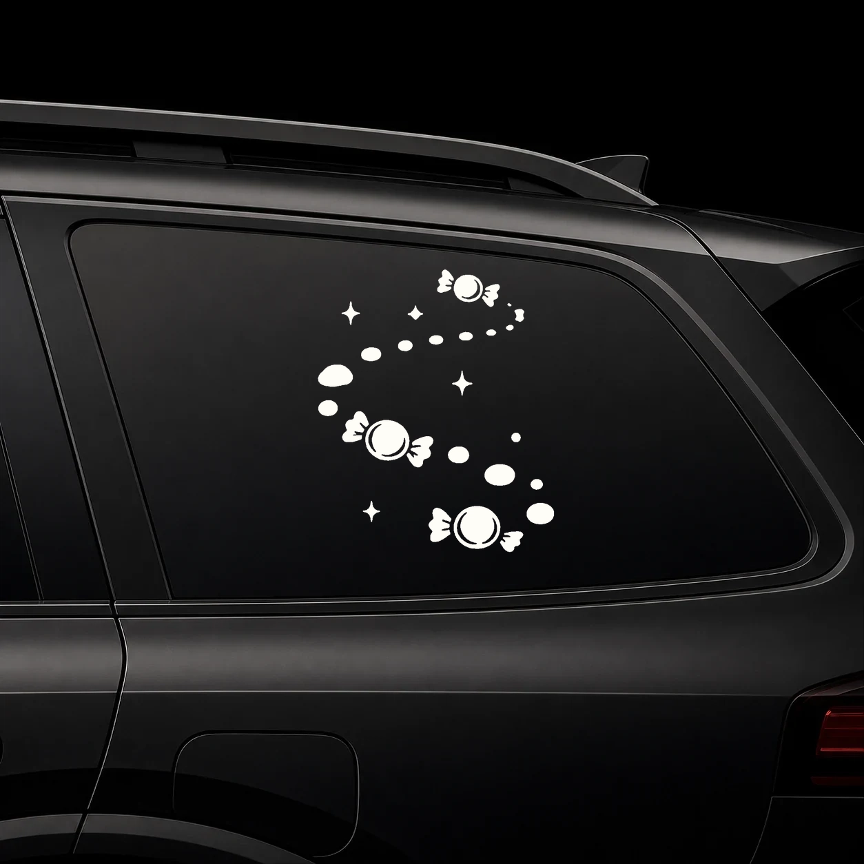Candy trail decal on a dark vehicle window