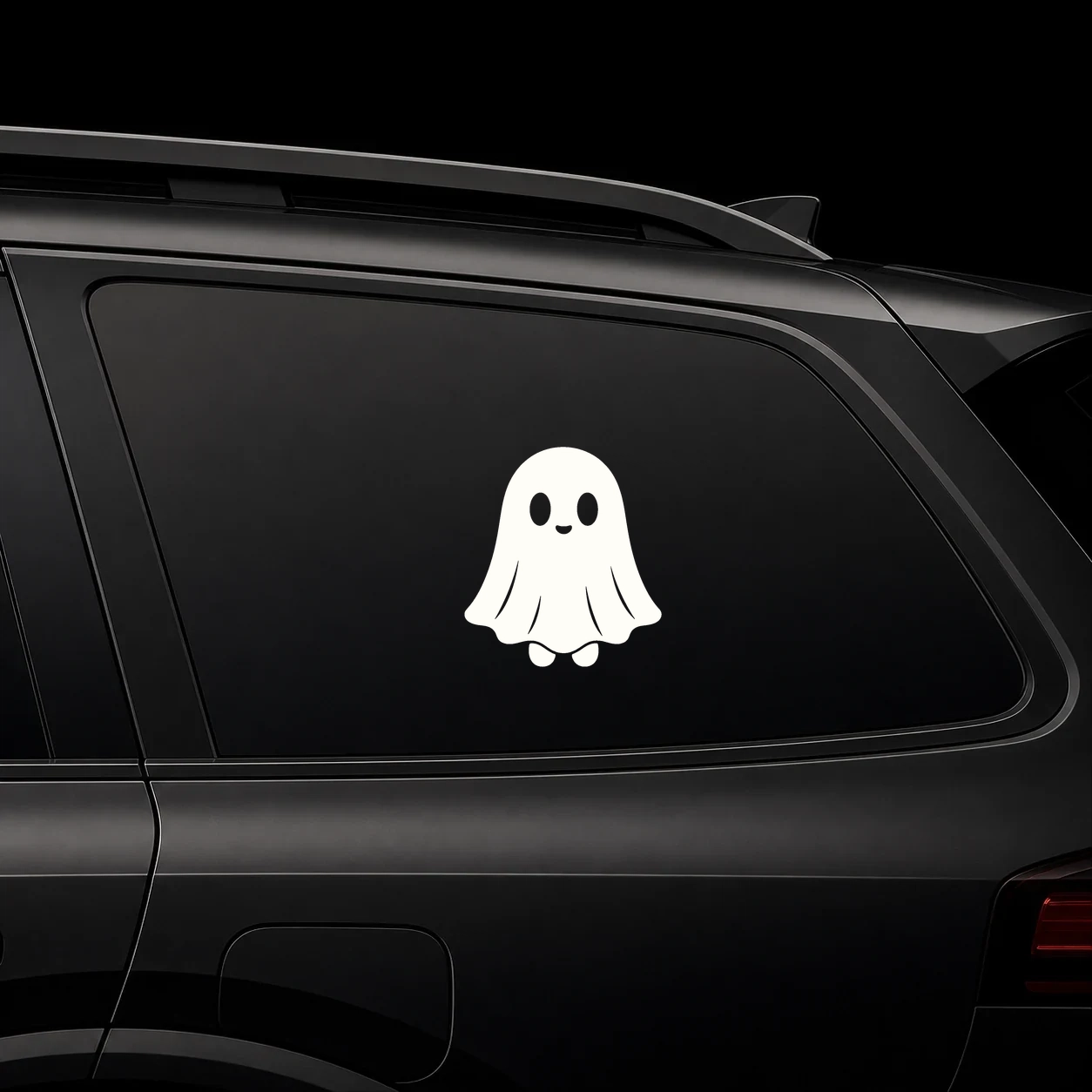 Cute ghost in a sheet decal on a dark vehicle window