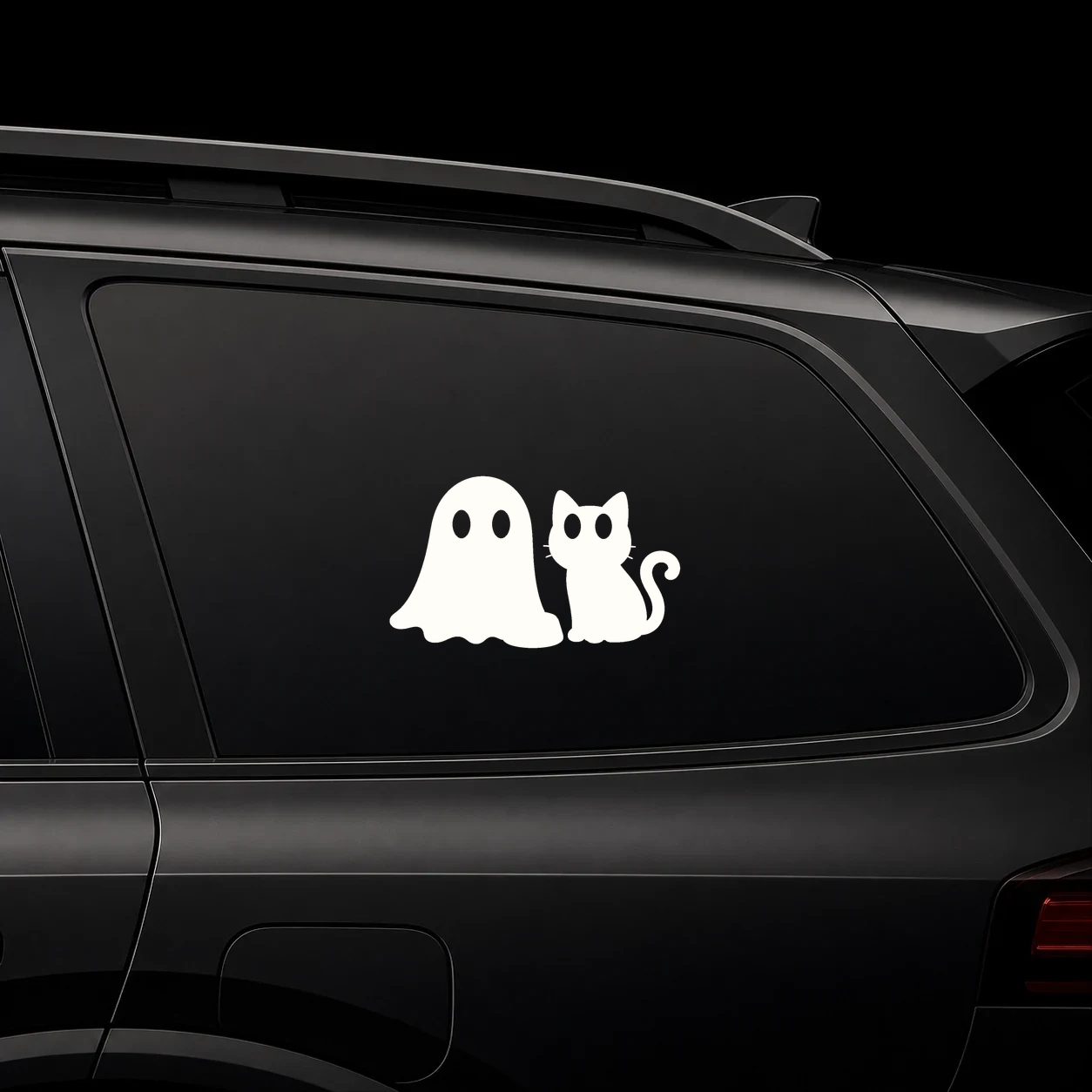 Cute ghost with black cat decal on a dark vehicle window