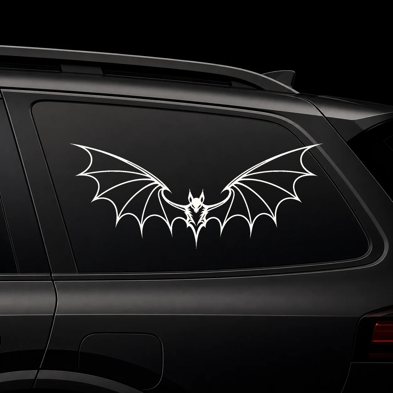 Gothic bat wings on a dark vehicle window