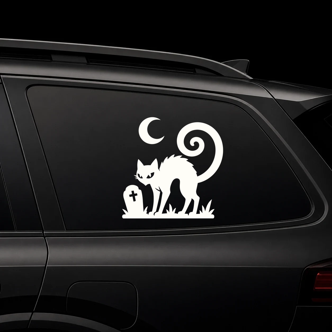 Warm ivory black cat & crescent moon decal on a dark vehicle window
