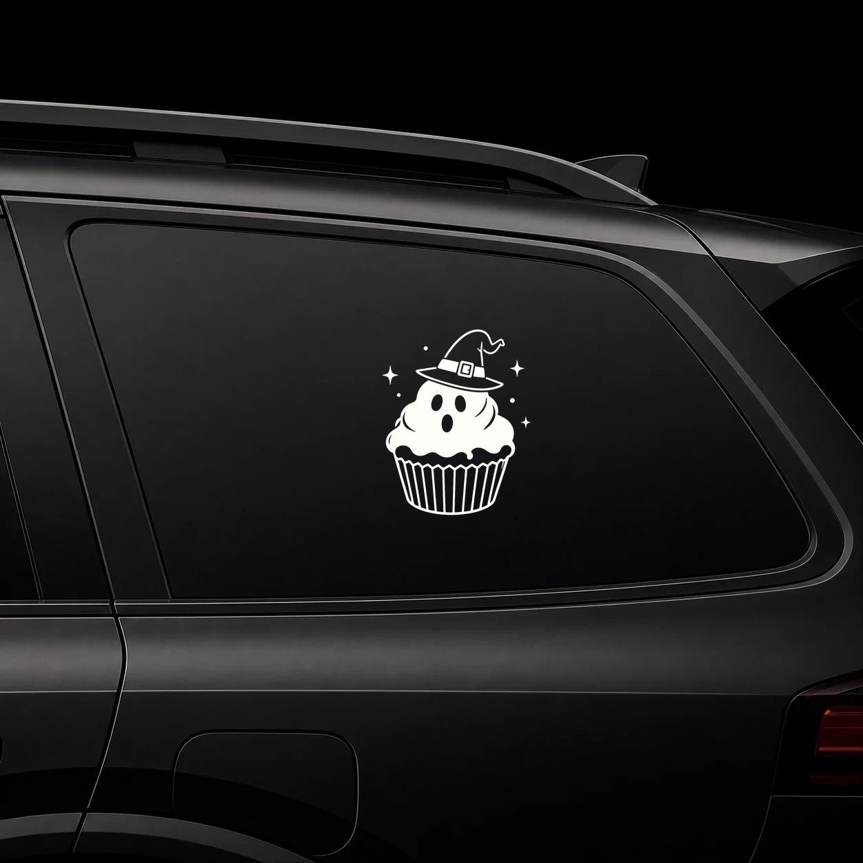 Haunted cupcake decal on a dark vehicle window