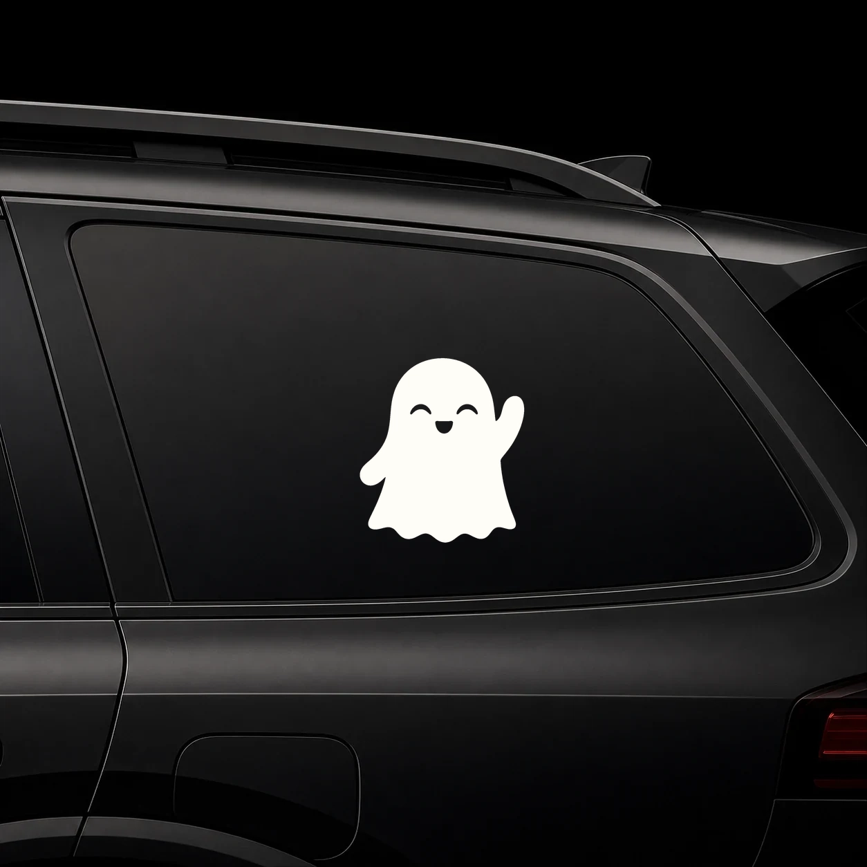 Cute waving ghost decal on a dark vehicle window