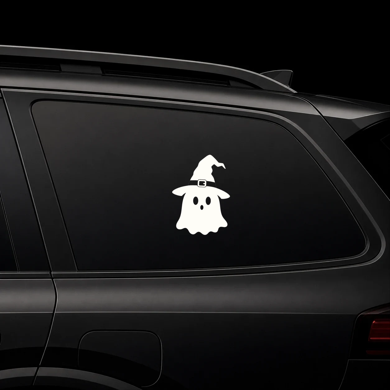 Cute witch hat ghost decal on a dark vehicle window