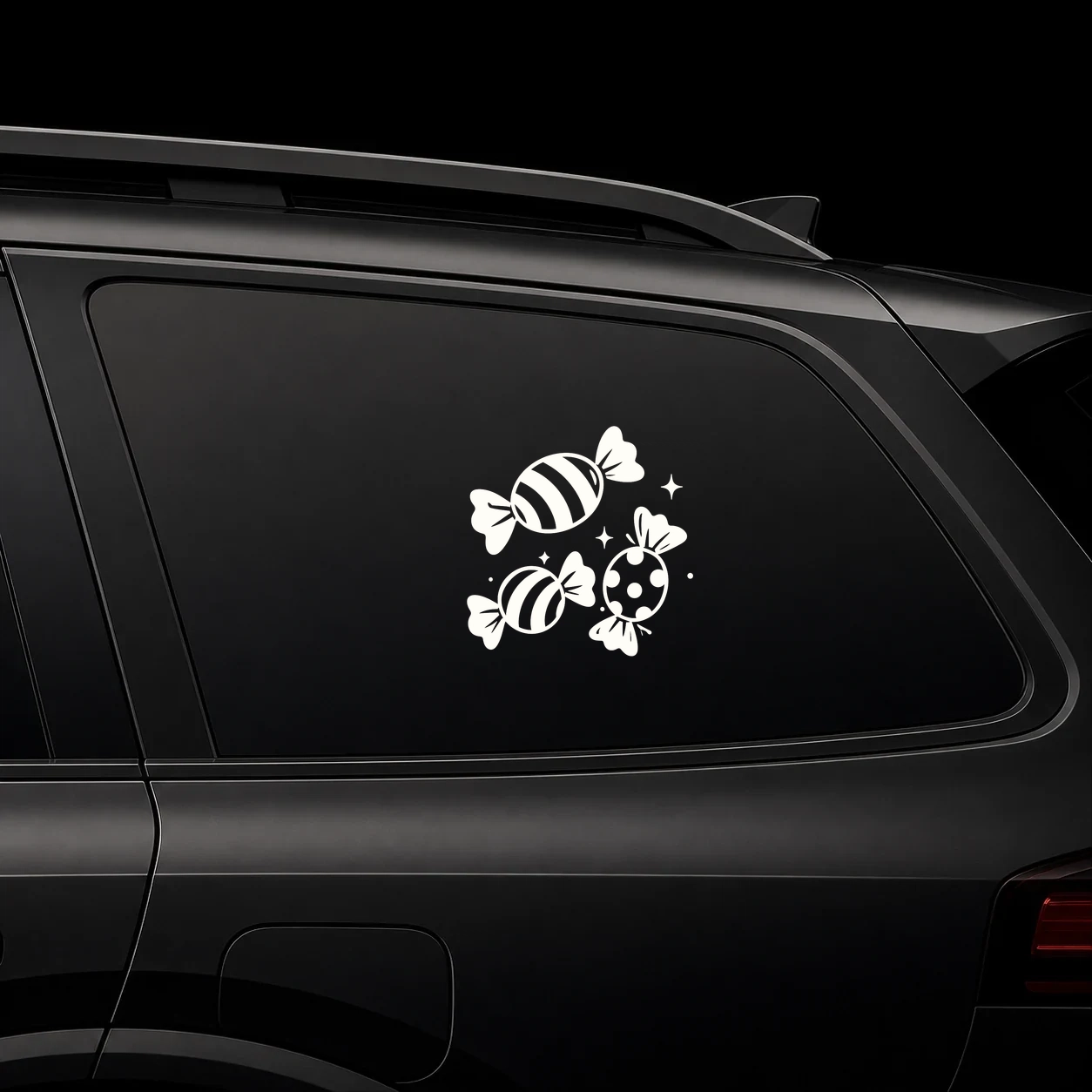 Wrapped candies decal on a dark vehicle window