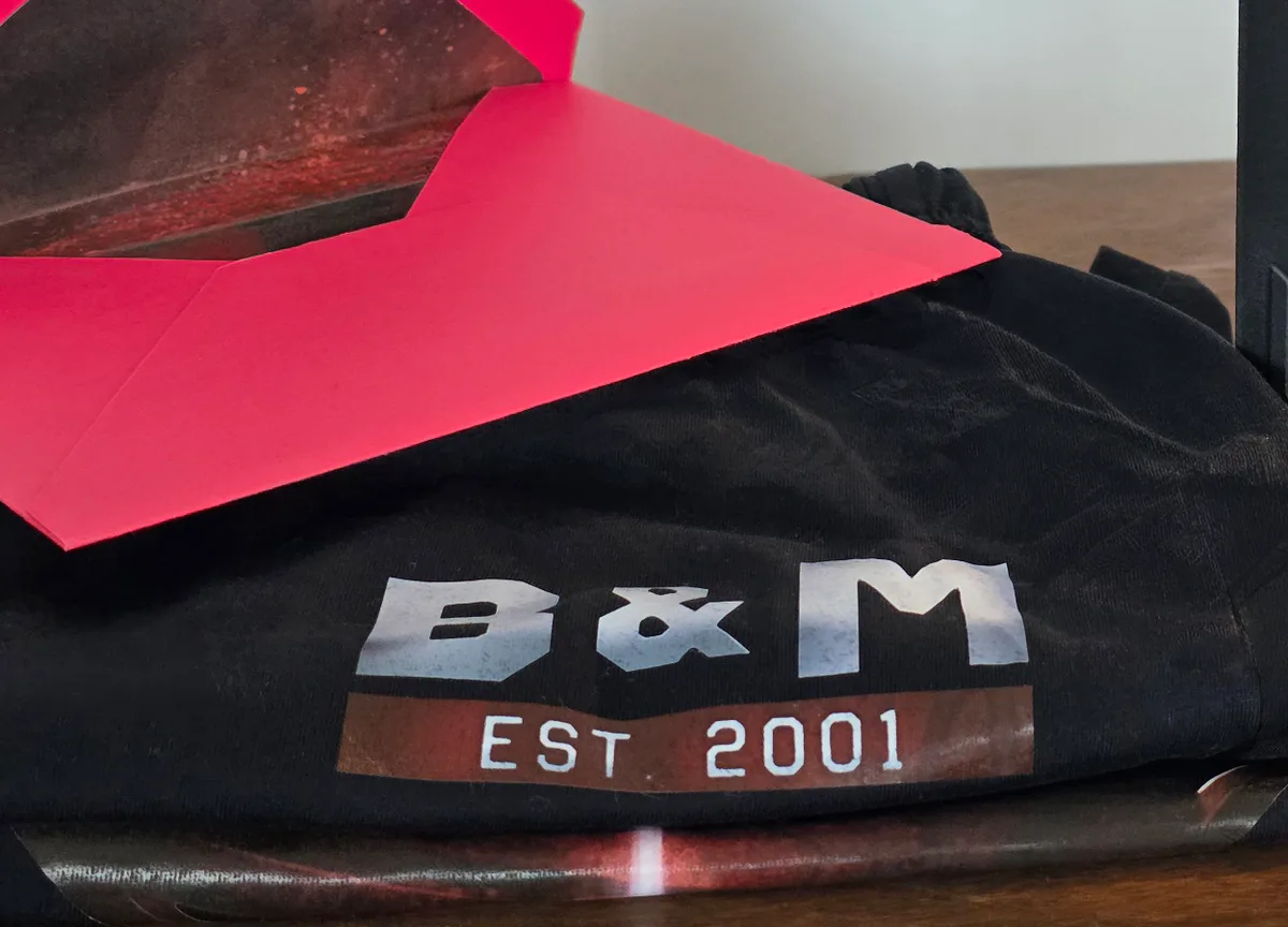 Personalized black anniversary lounge set with monogram and red envelope