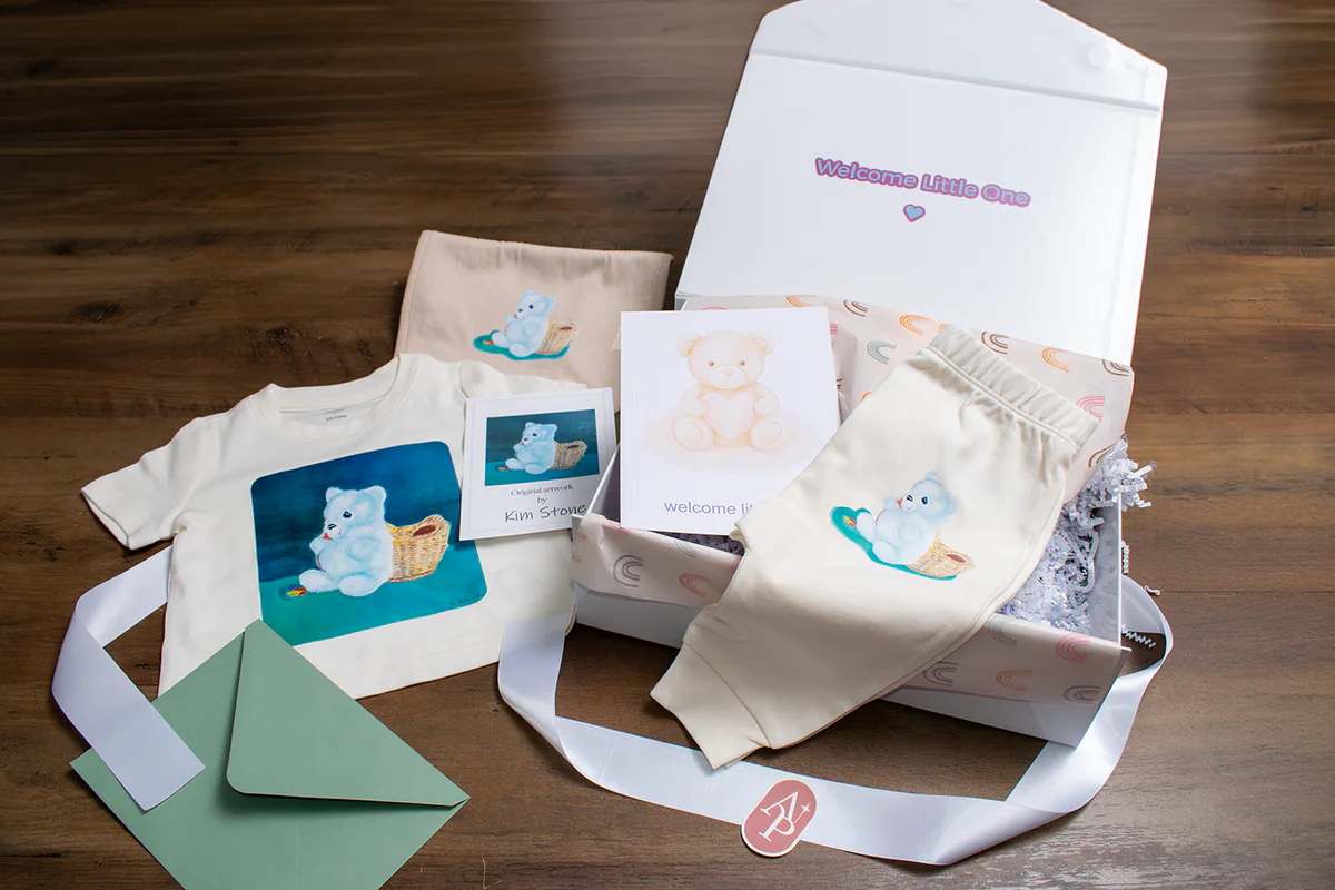 Personalized new baby apparel, matching card and coordinated gift-box presentation