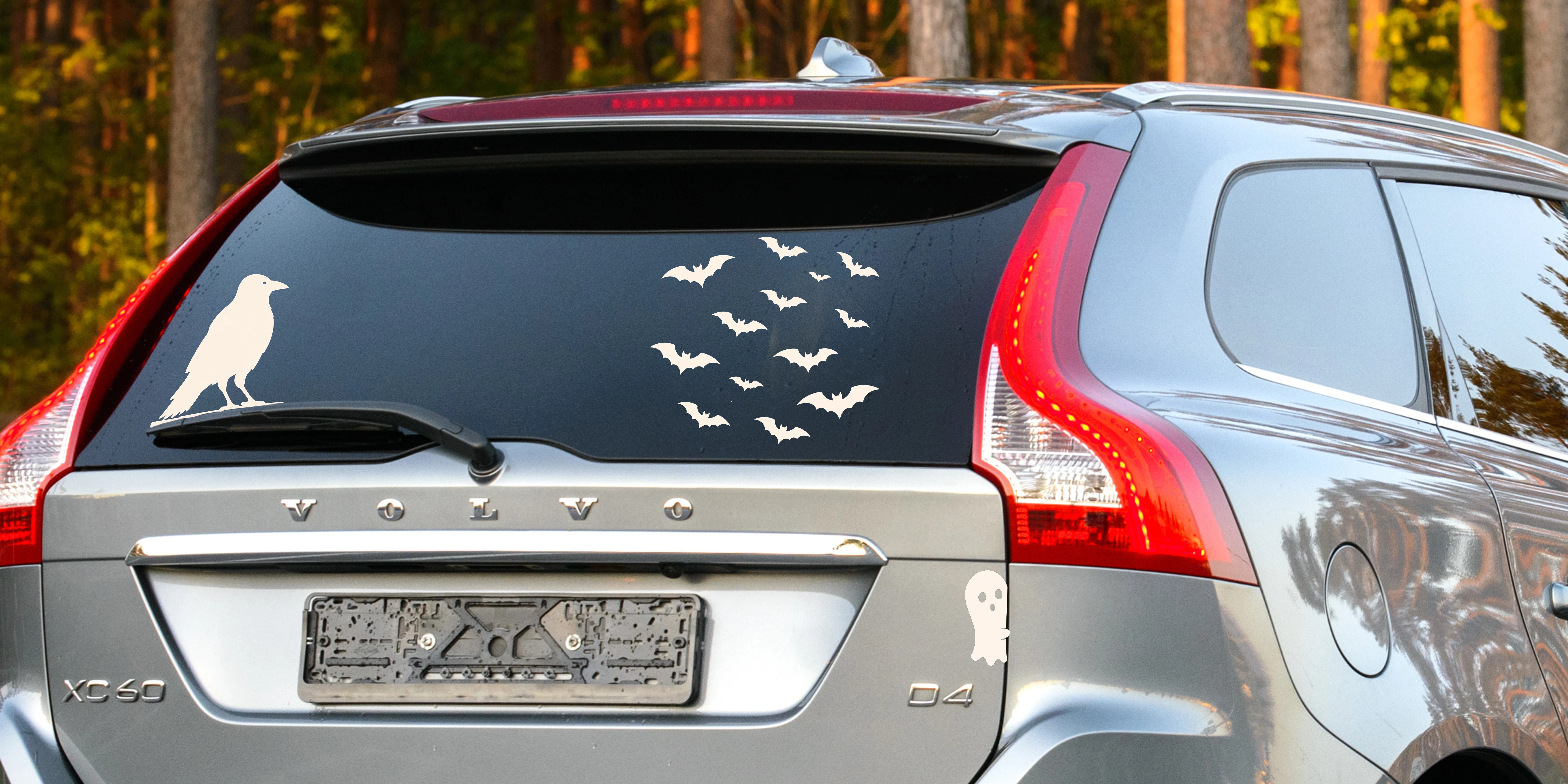 Fuel-door ghosts, raven, and bat swarm installed across the rear of a vehicle
