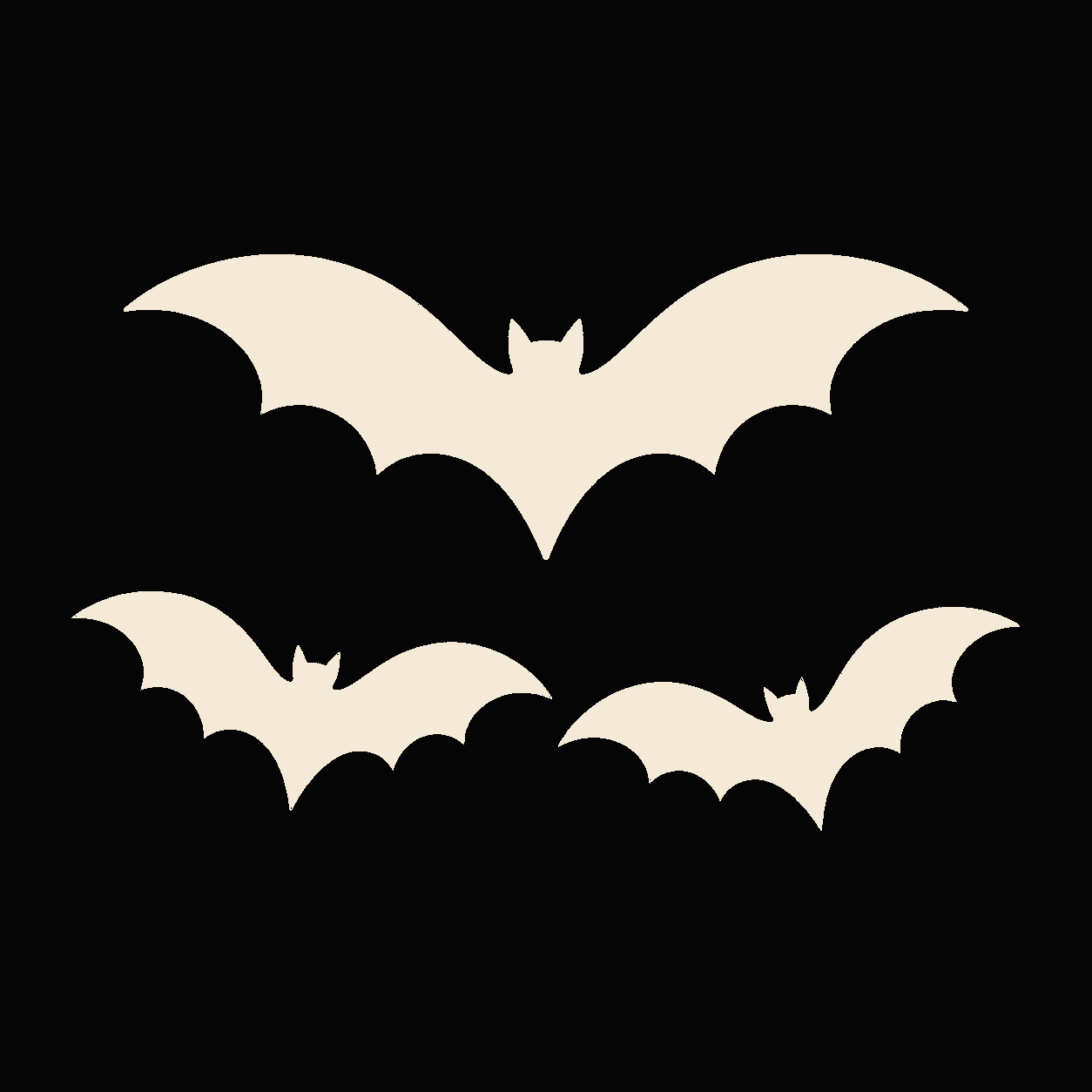 Three large bat decals on a dark vehicle rear side window